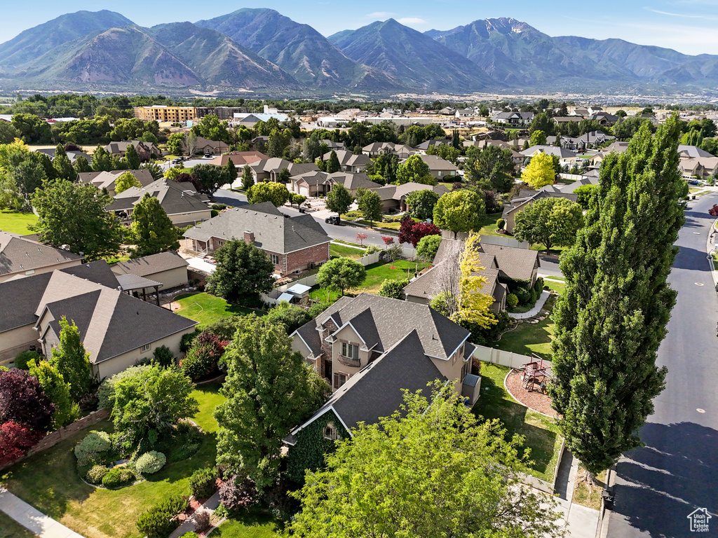 Aerial view of residential area featuring a mountain backdrop