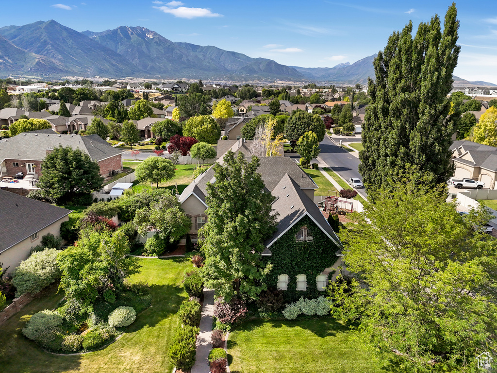 Aerial view of residential area featuring mountains