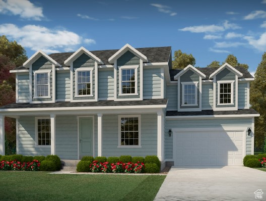 View of front of property with concrete driveway, covered porch, an attached garage, and a front lawn