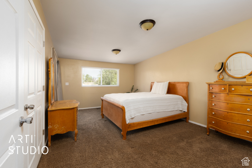Carpeted bedroom with baseboards