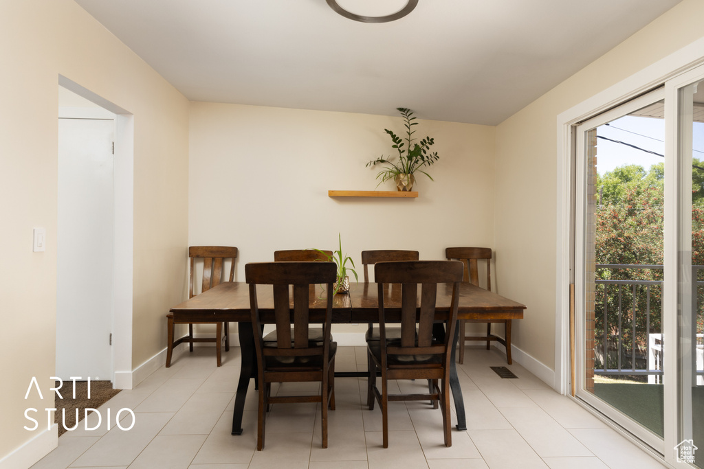 Dining area featuring light tile patterned floors