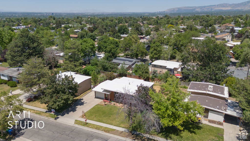 Aerial view of residential area featuring a mountainous background