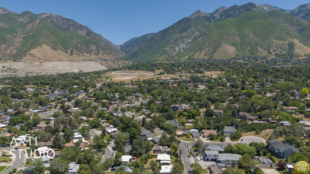 Aerial view of property's location with a mountain backdrop