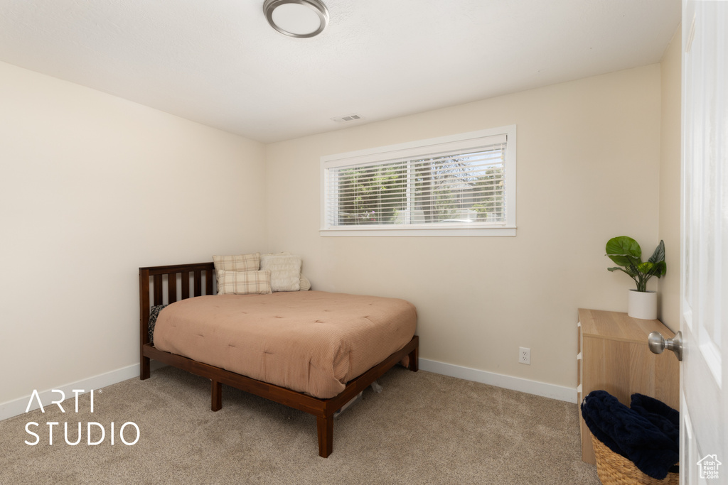 Carpeted bedroom with baseboards