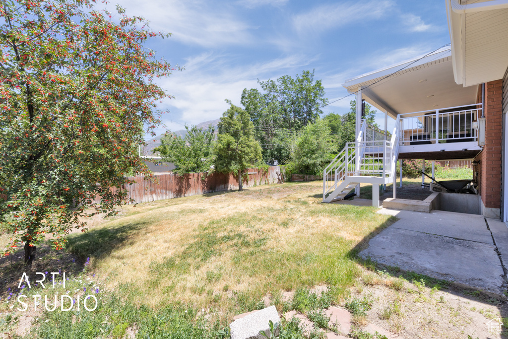 View of yard featuring stairs