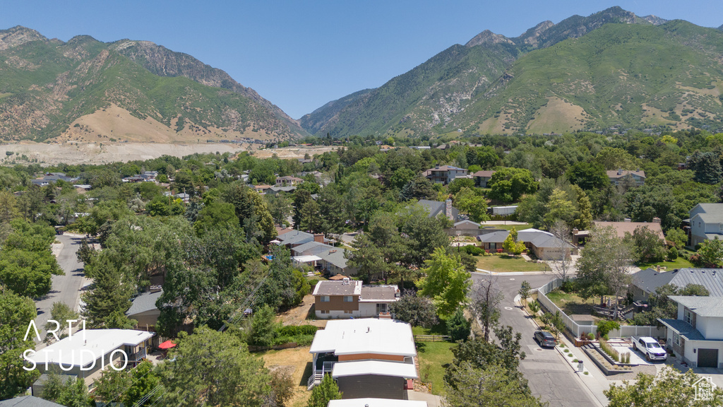 Aerial perspective of suburban area featuring a mountainous background
