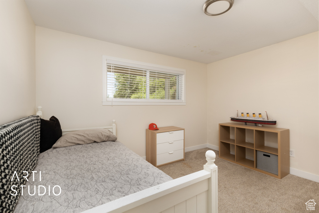 Bedroom with carpet and baseboards