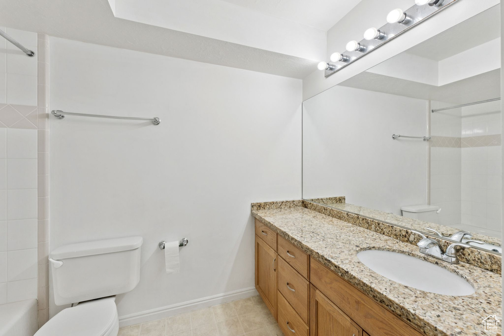 Bathroom featuring vanity and shower / bathtub combination