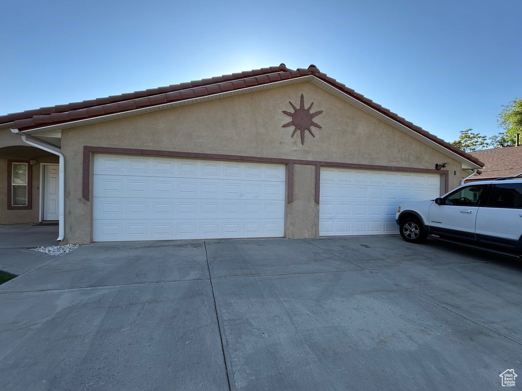 Garage with concrete driveway
