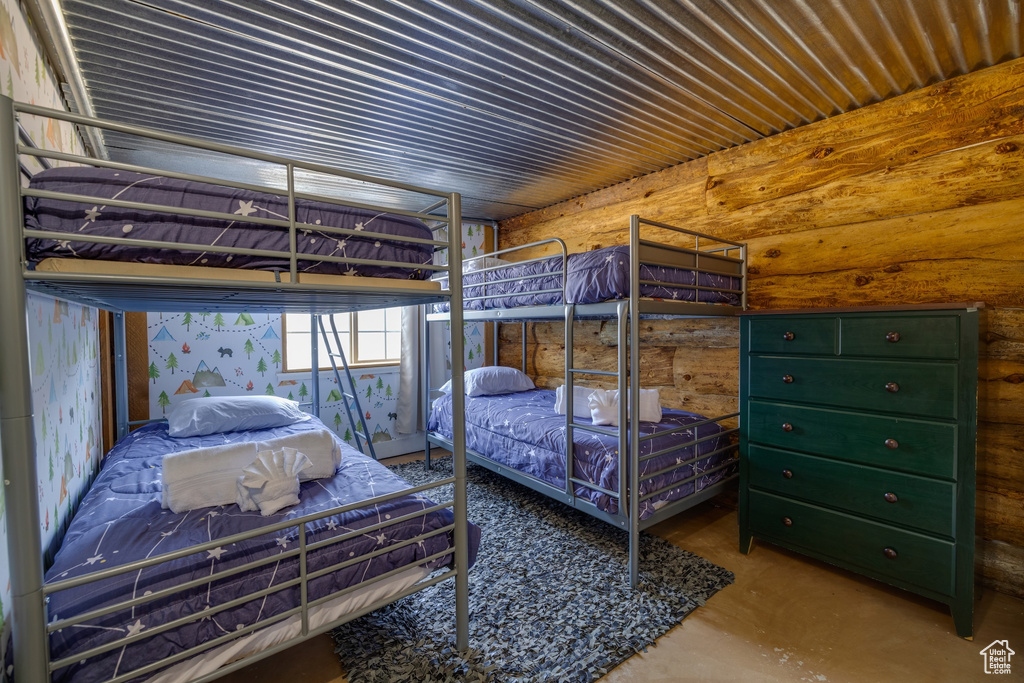 Bedroom featuring concrete floors