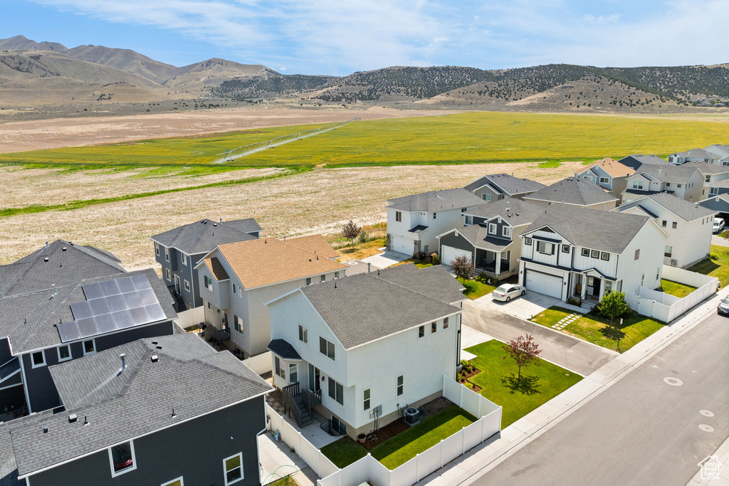 Aerial view of residential area featuring mountains