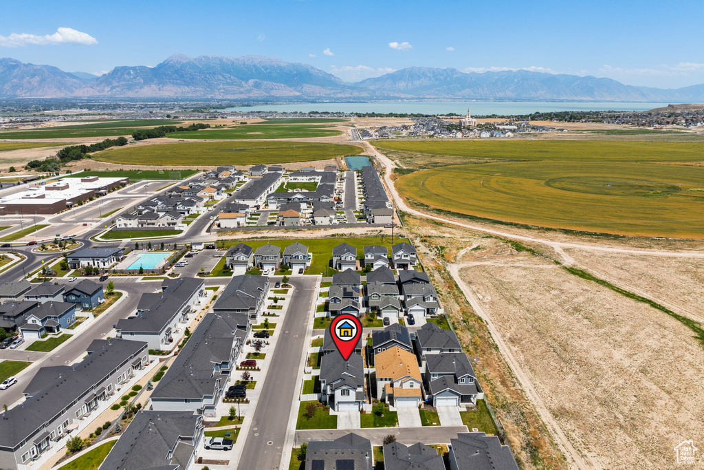 Aerial perspective of suburban area with a water and mountain view