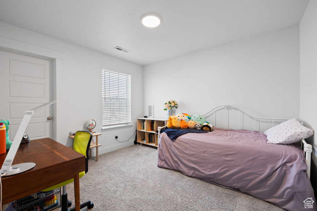 Bedroom with carpet and baseboards
