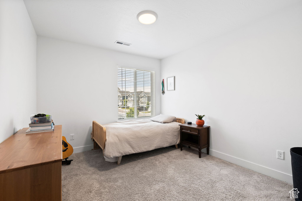 Bedroom with carpet flooring