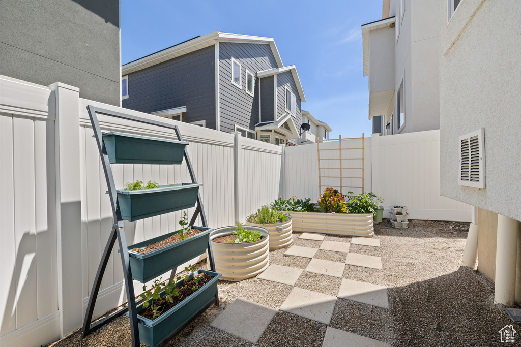 View of patio featuring a vegetable garden