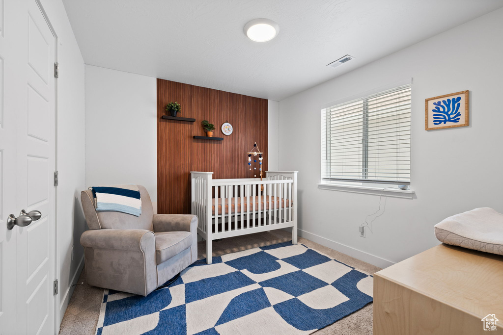 Carpeted bedroom with baseboards