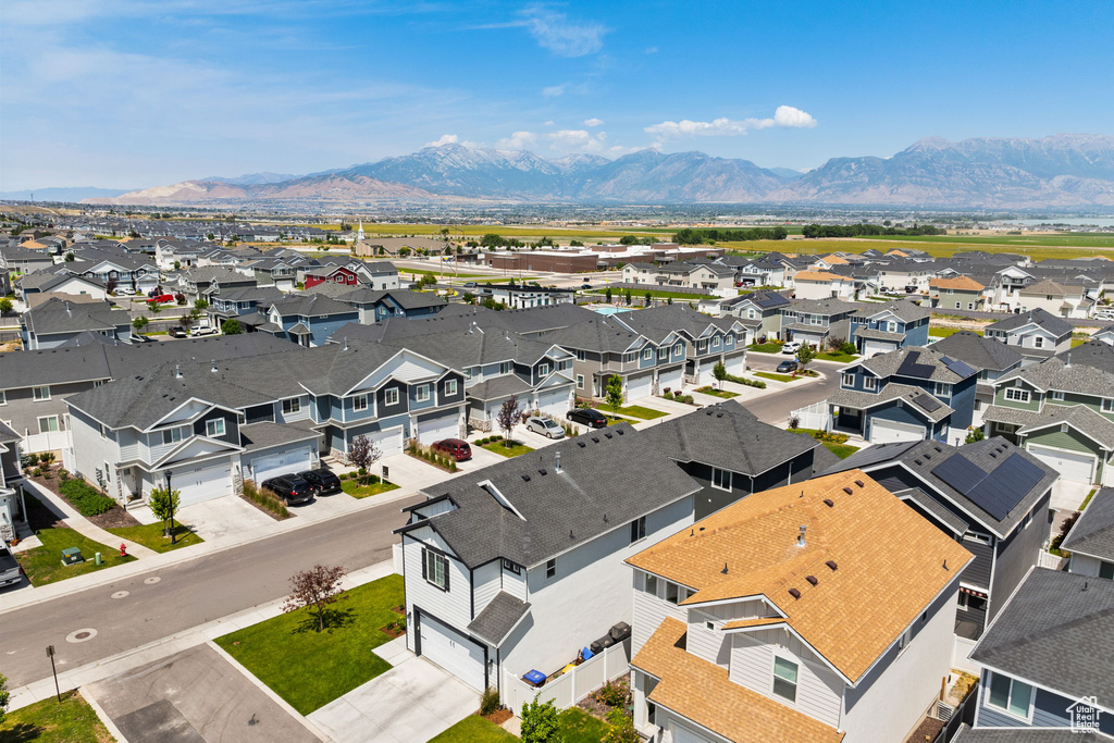 Aerial view of residential area featuring a mountain backdrop