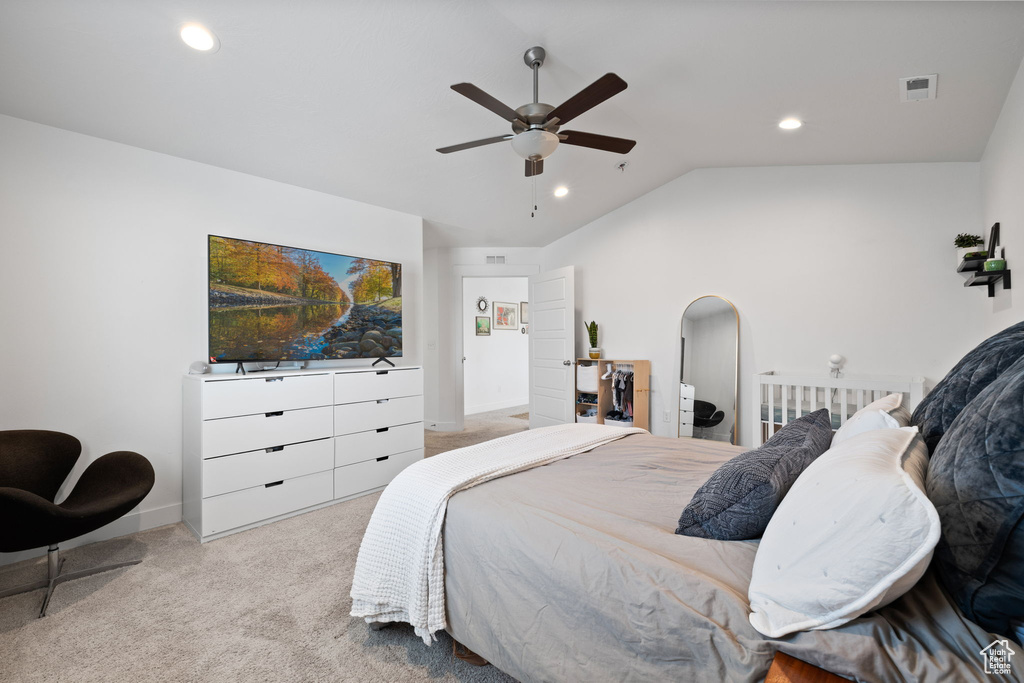 Carpeted bedroom with vaulted ceiling, recessed lighting, and ceiling fan