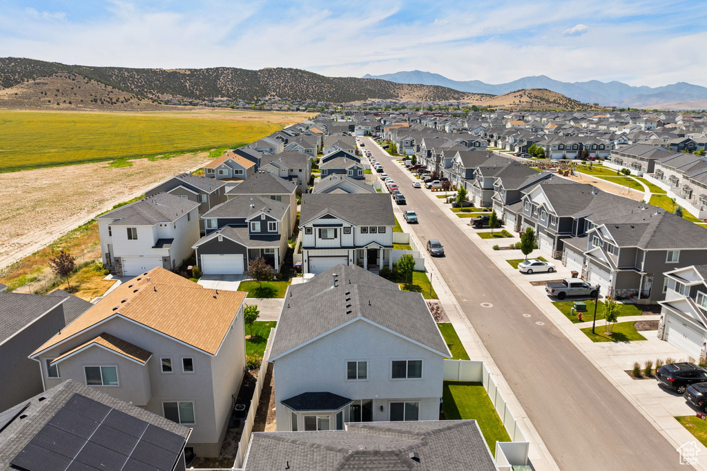 Aerial view of residential area featuring a mountainous background