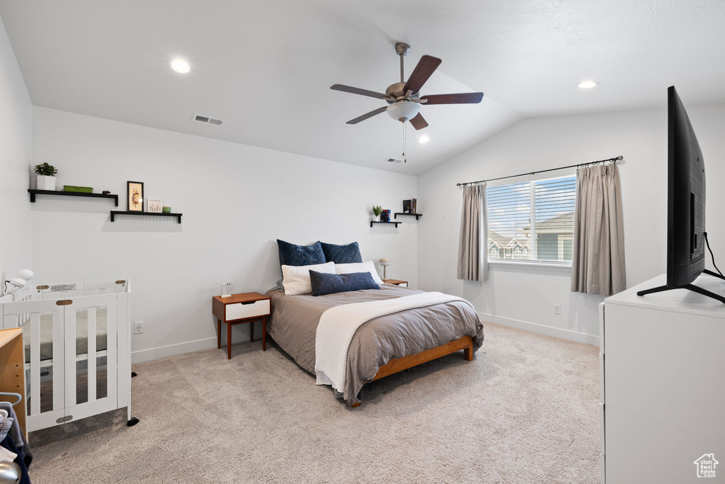 Bedroom with carpet floors, vaulted ceiling, recessed lighting, and ceiling fan