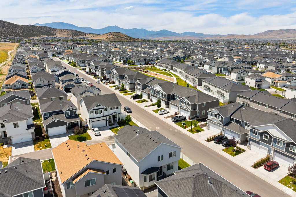 Aerial perspective of suburban area featuring a mountain backdrop