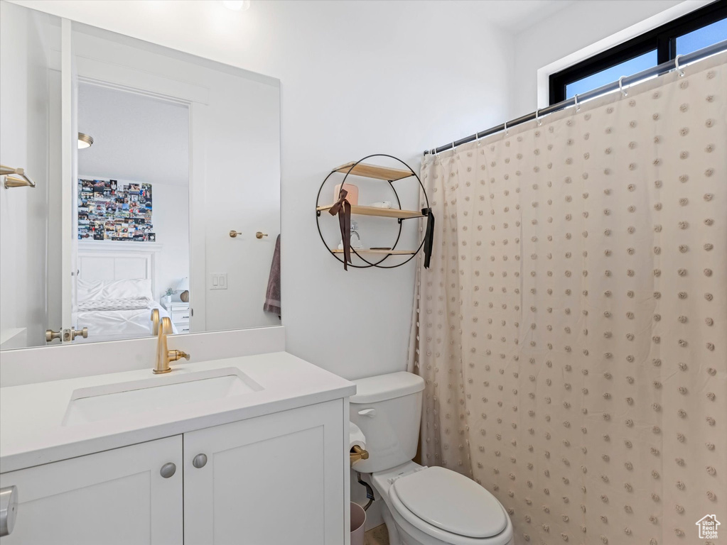Bathroom with vanity and a shower with shower curtain