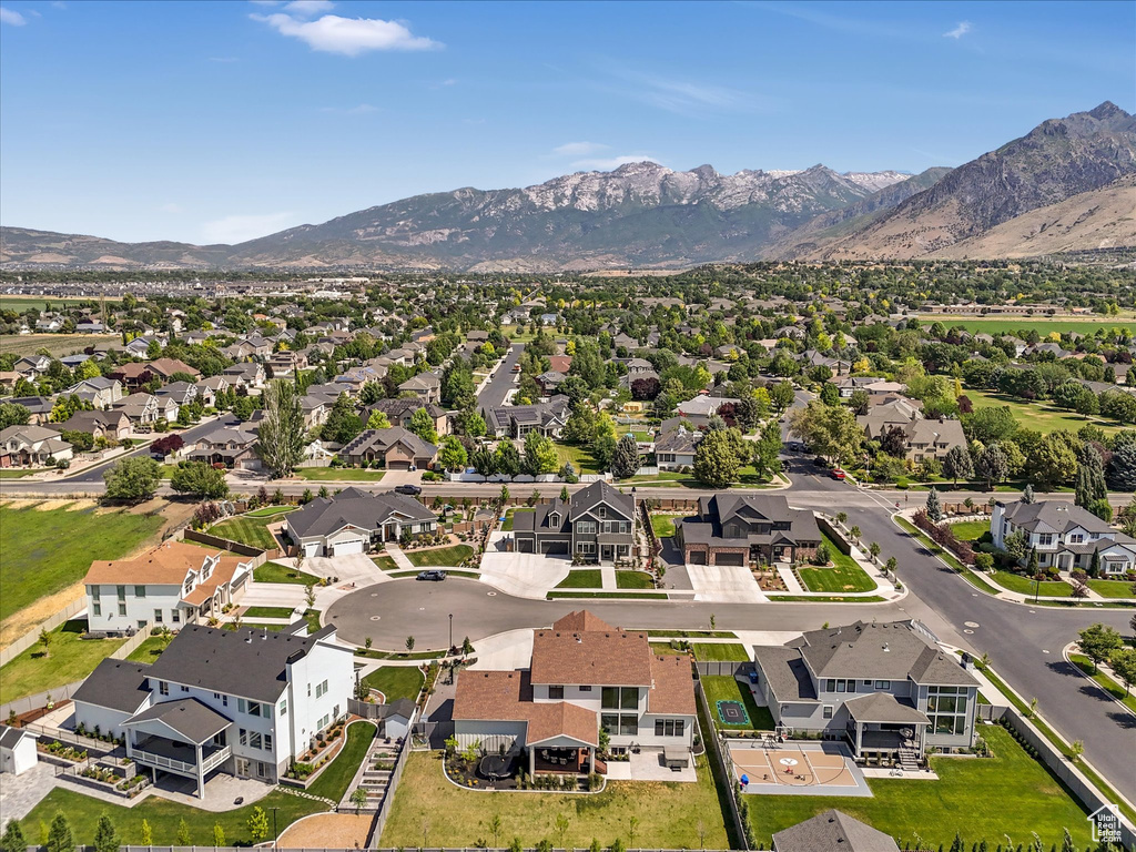 Aerial view of residential area featuring a mountain backdrop
