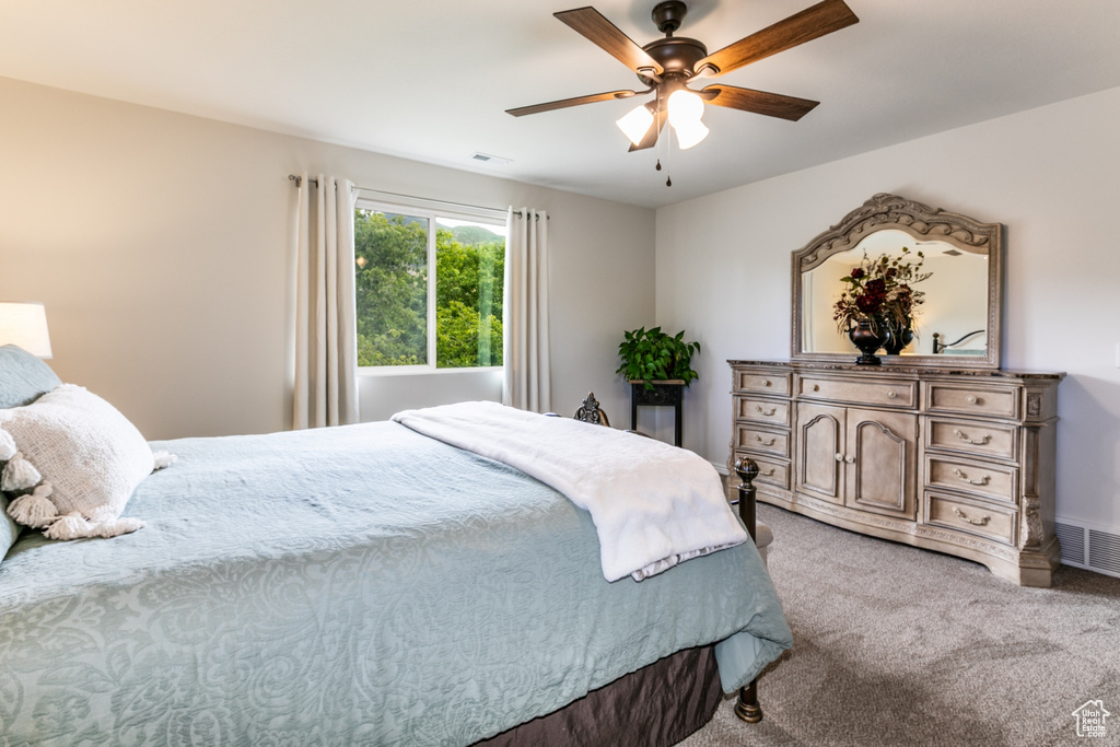 Bedroom with carpet flooring and ceiling fan