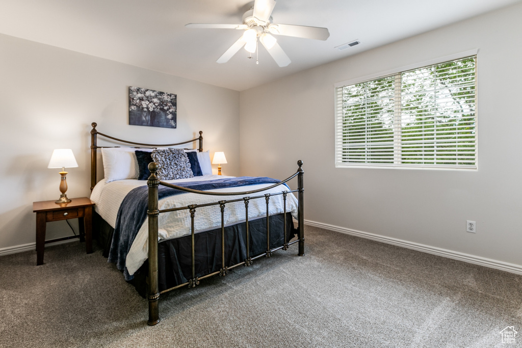 Bedroom with carpet floors and a ceiling fan