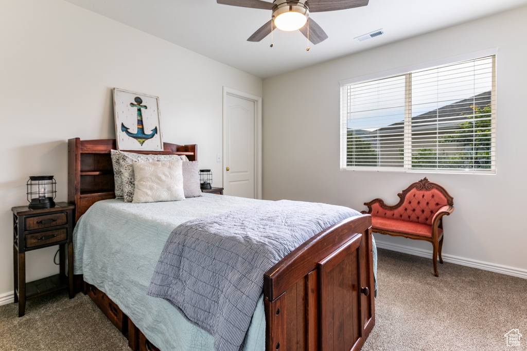 Bedroom with carpet floors and ceiling fan