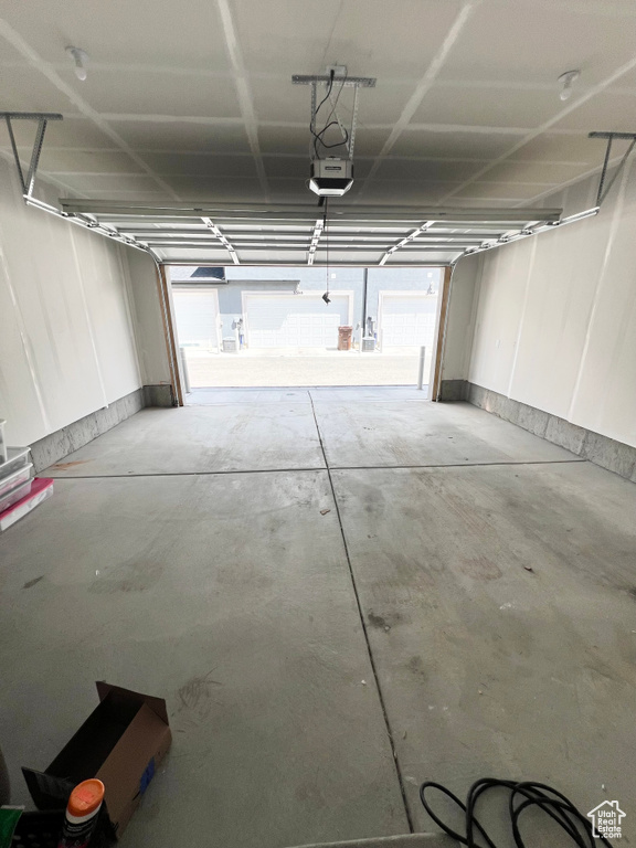 Garage featuring a garage door opener