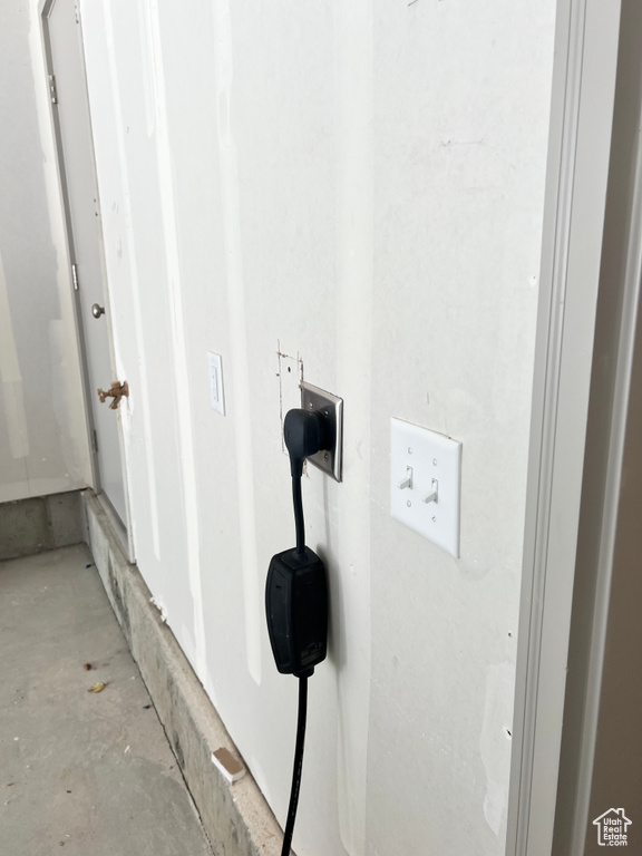 Laundry view of concrete flooring