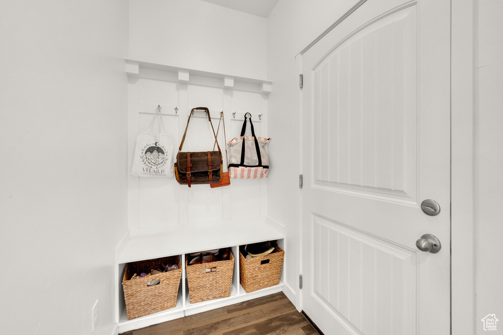 Mudroom featuring dark wood-style floors