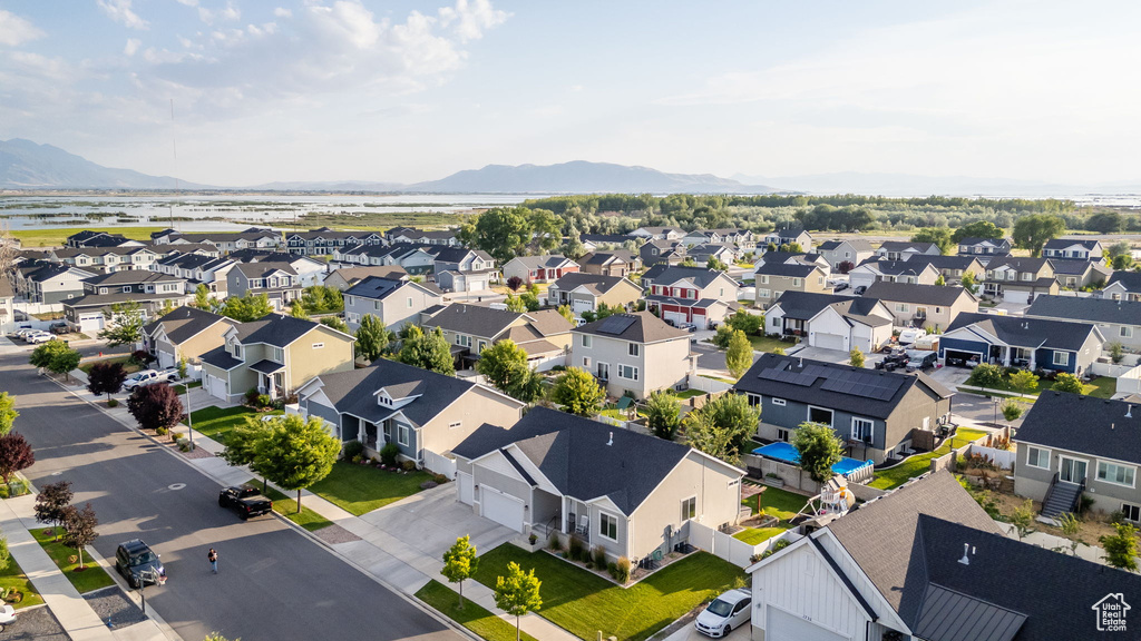 Aerial perspective of suburban area featuring a mountain backdrop