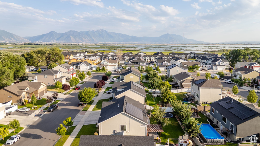 Aerial perspective of suburban area featuring a mountain backdrop