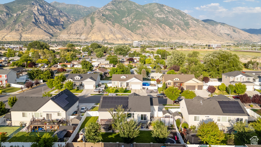 Aerial perspective of suburban area featuring a mountainous background
