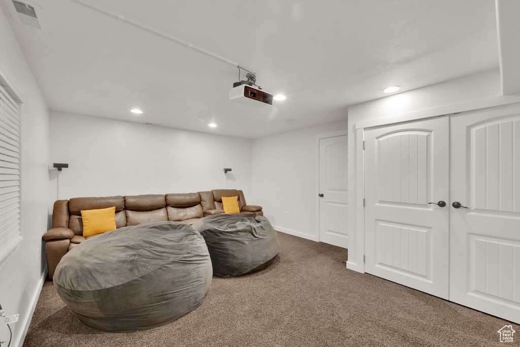 Home theater with carpet and recessed lighting