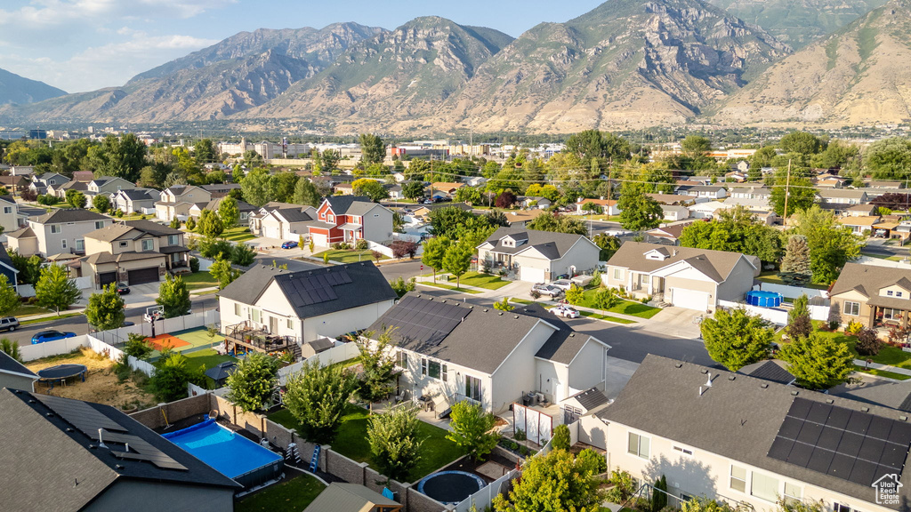 Aerial view of residential area featuring a mountain backdrop