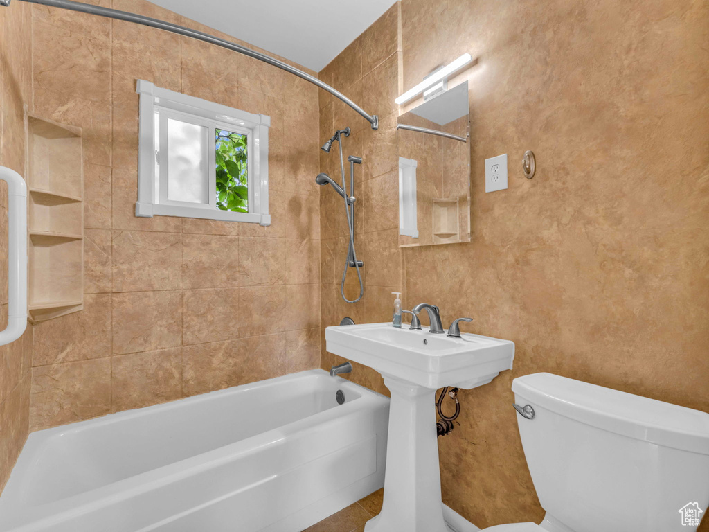 Full bath featuring shower / bathtub combination and toilet
