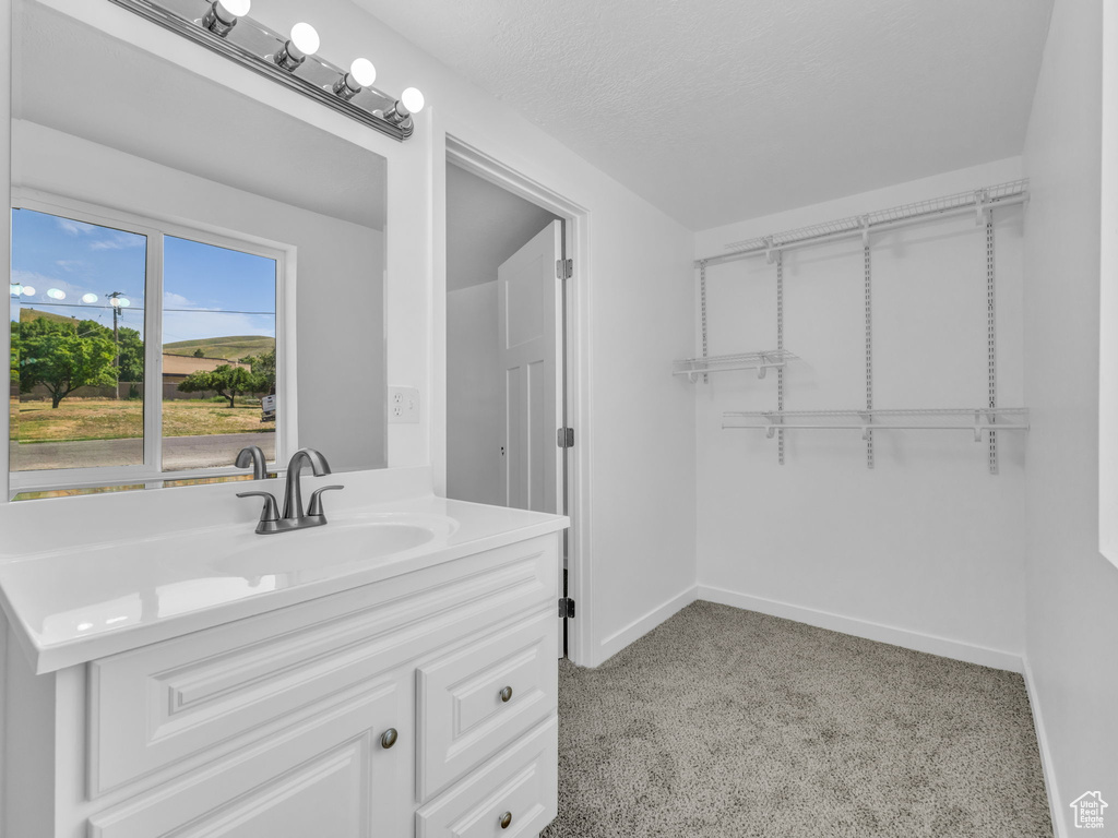 Bathroom with vanity and baseboards
