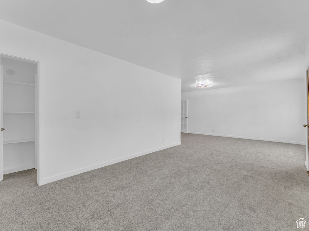 Unfurnished room featuring carpet flooring