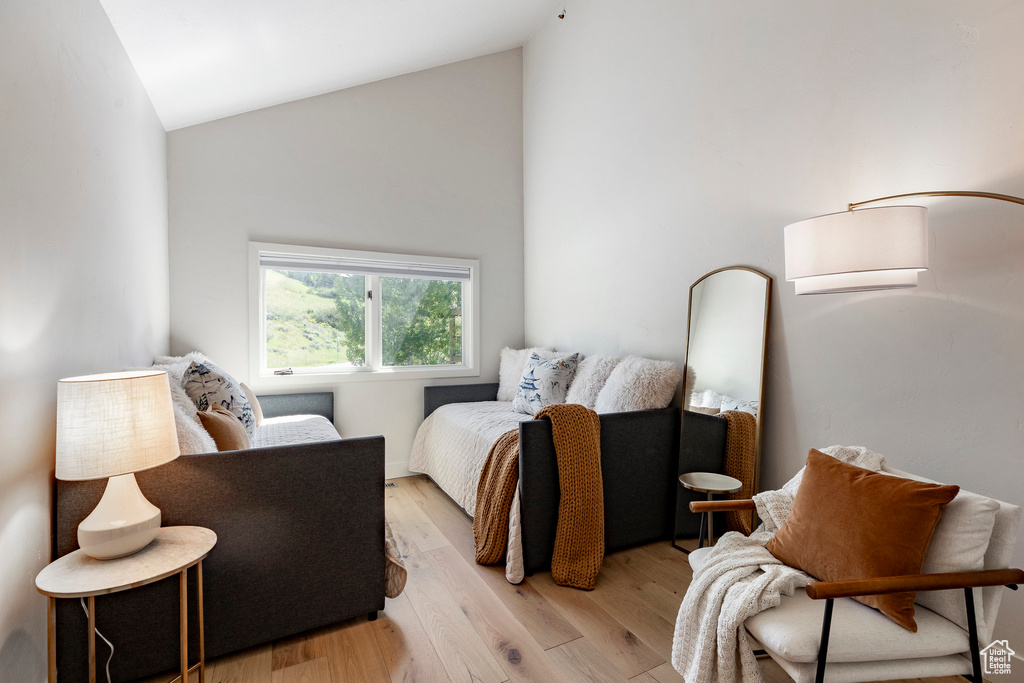 Bedroom featuring vaulted ceiling and light wood-style flooring