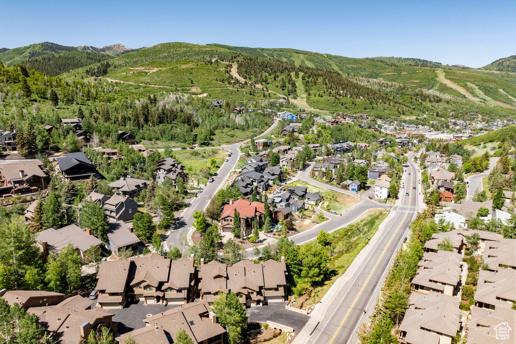Aerial perspective of suburban area with a mountain backdrop