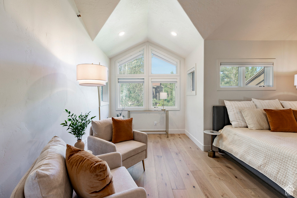 Bedroom featuring vaulted ceiling and light wood finished floors
