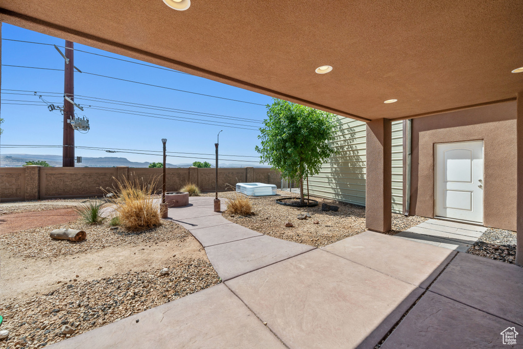 Fenced backyard with a patio area