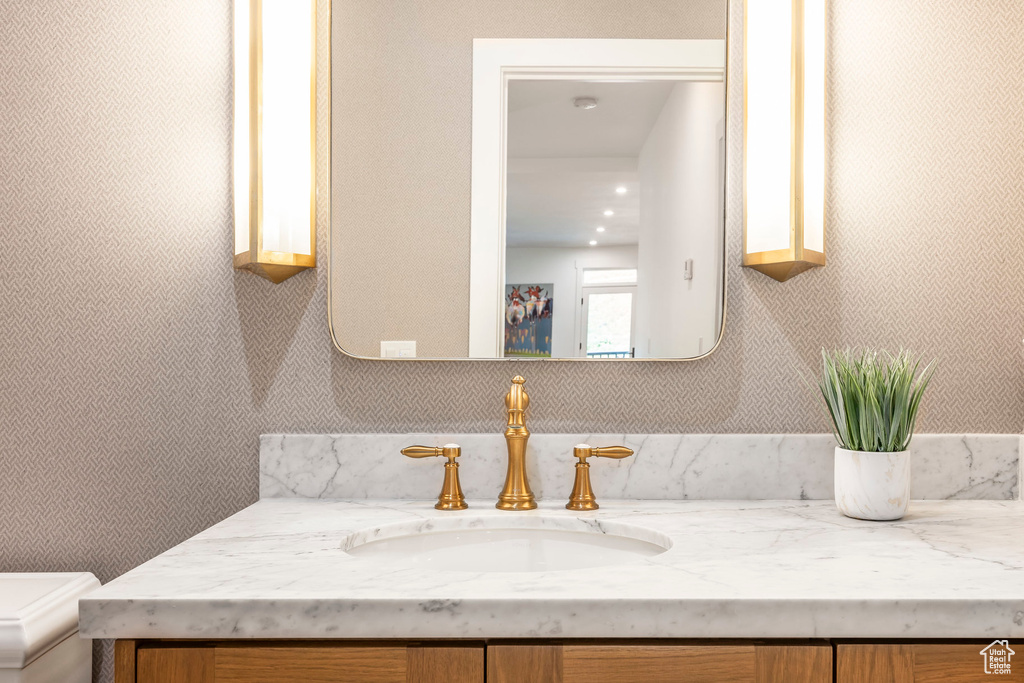 Bathroom featuring vanity and toilet
