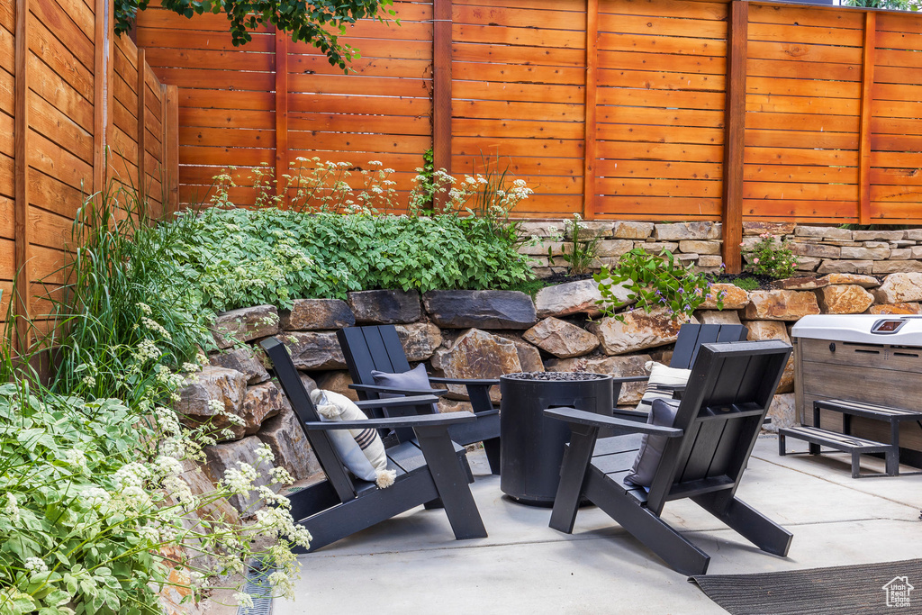 View of patio / terrace featuring an outdoor fire pit
