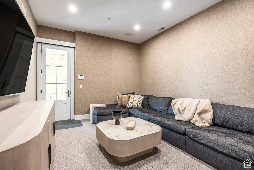 Living room with carpet flooring and recessed lighting