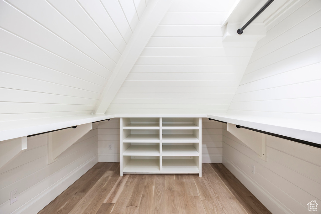 Spacious closet with light wood-style floors