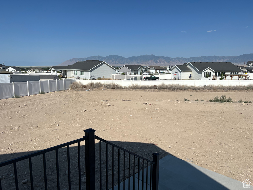 View of yard with a mountain view and a residential view